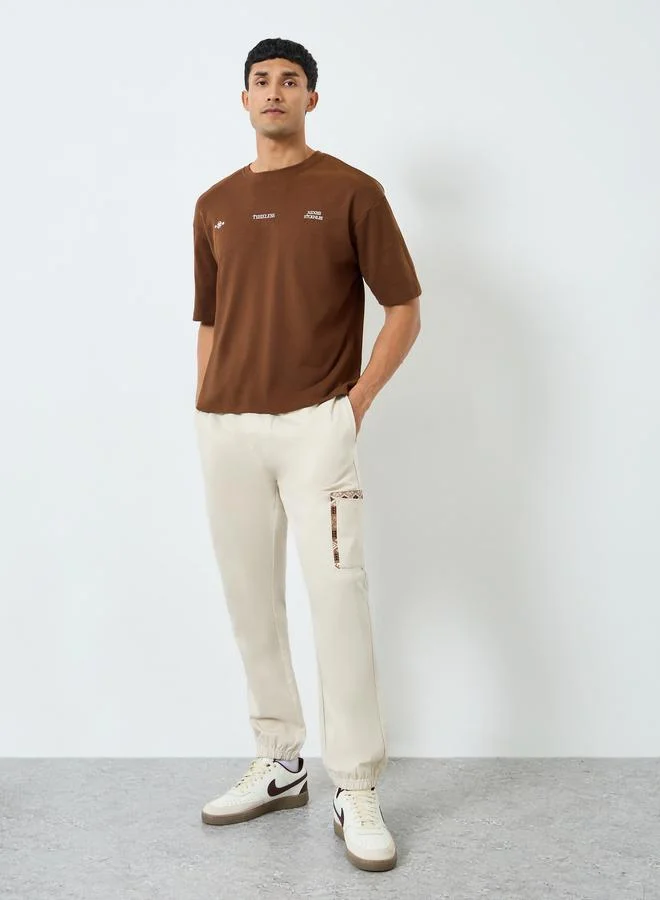Men Beige Slim Fit Joggers with Pocket Detail